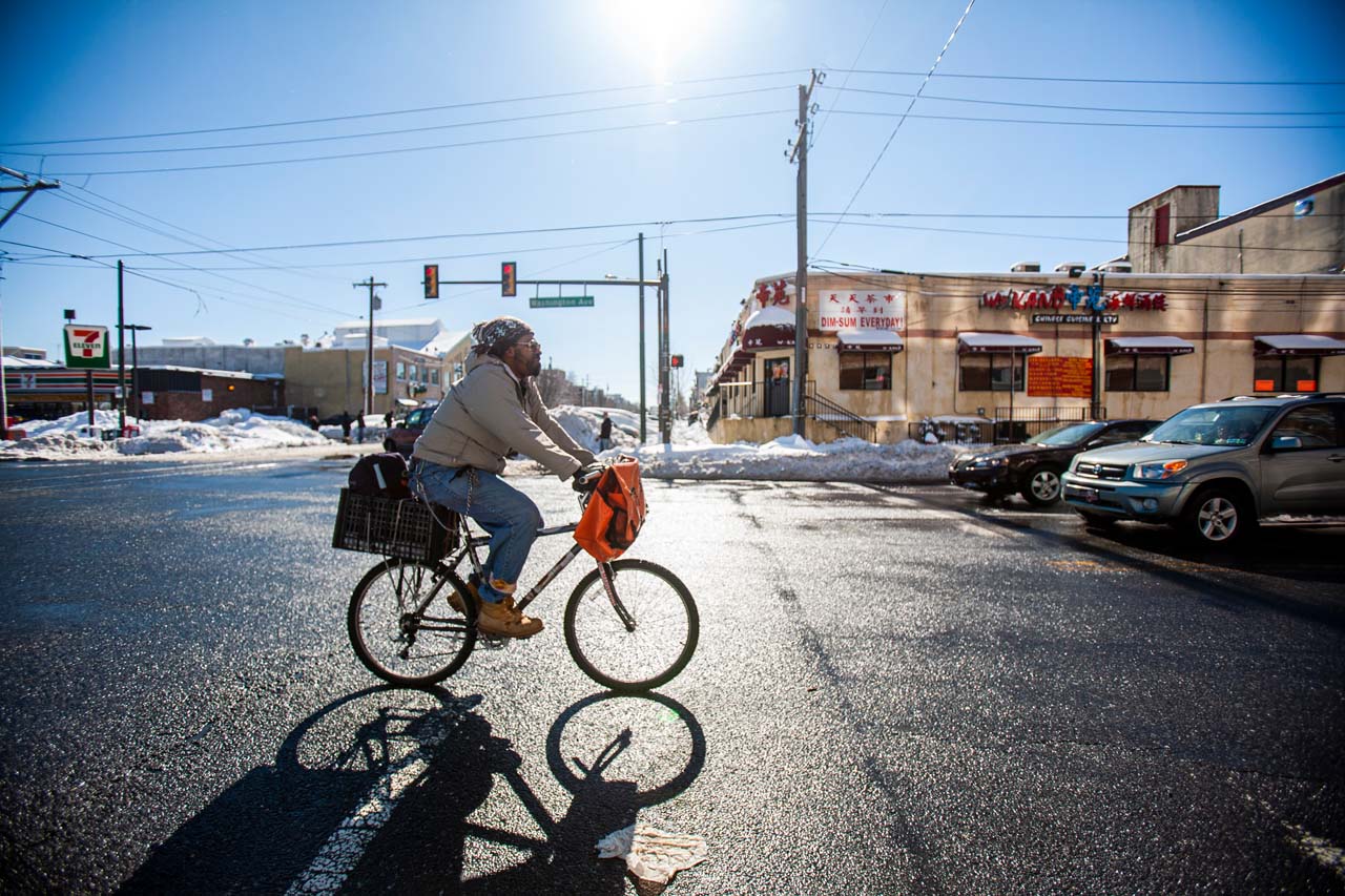 Man riding bicycle on road